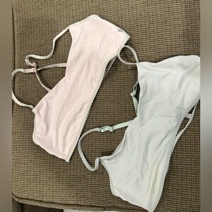 (2) Lululemon sports bras, size 10, pink and blue